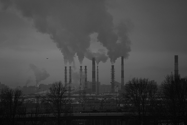 Factory with smoke coming from chimneys